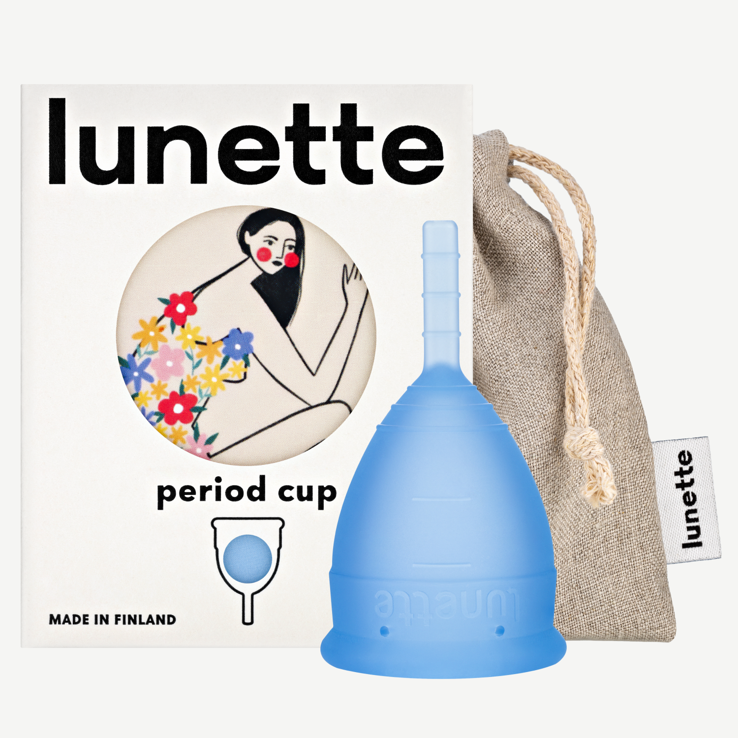 A blue Lunette period cup displayed alongside its packaging box with a floral design and a linen storage pouch. The box includes the text 'period cup', 'made in Finland', and the brand name 'Lunette'.